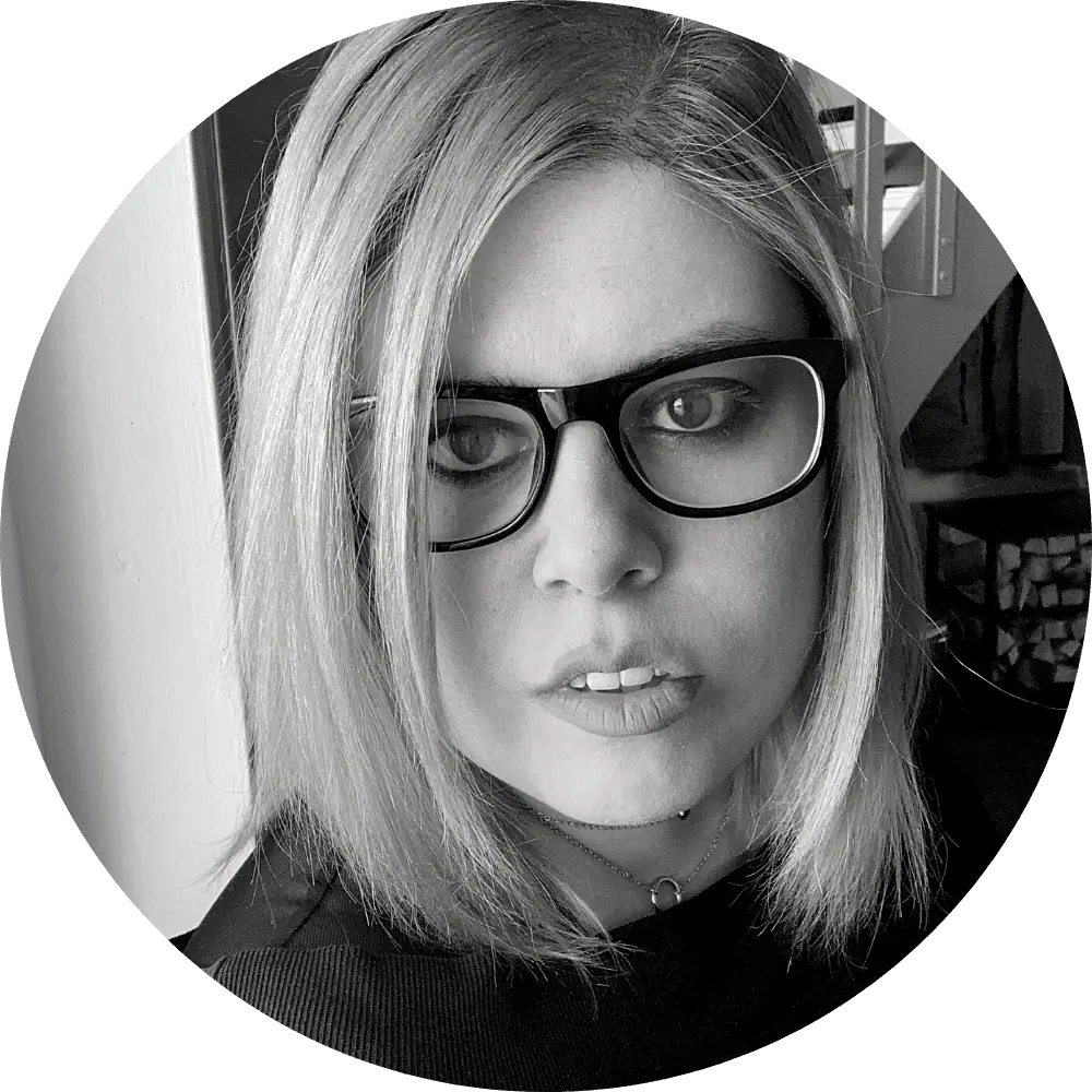 Maria Arango-Kure (she/they) looking into the camera.